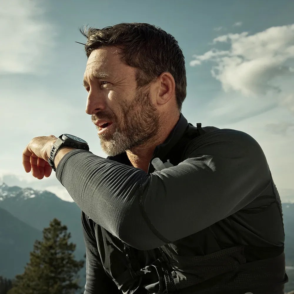 Man talking into his Garmin Fenix 8 watch