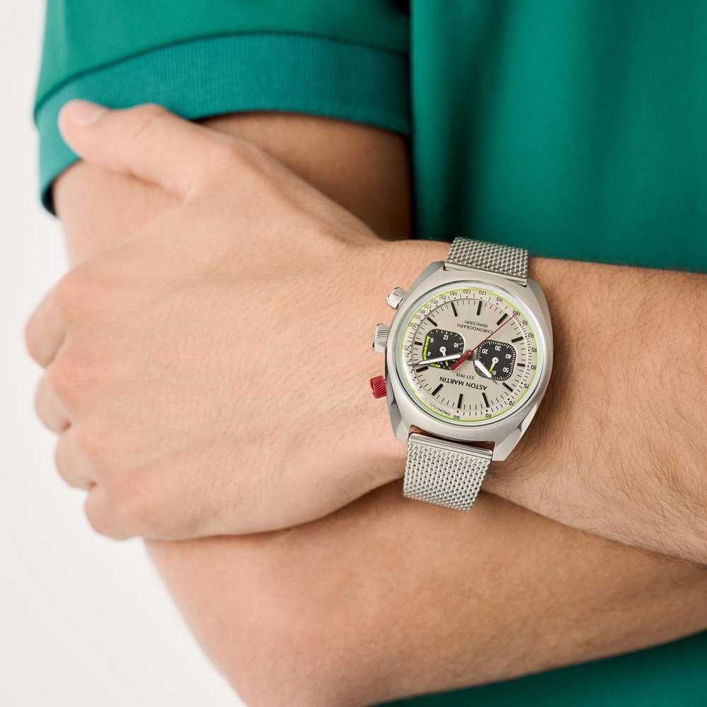 Man wearing an Aston Martin watch and an Aston green shirt
