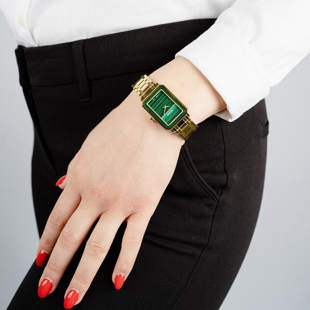 Woman wearing a Balmain watch with Malachite dial