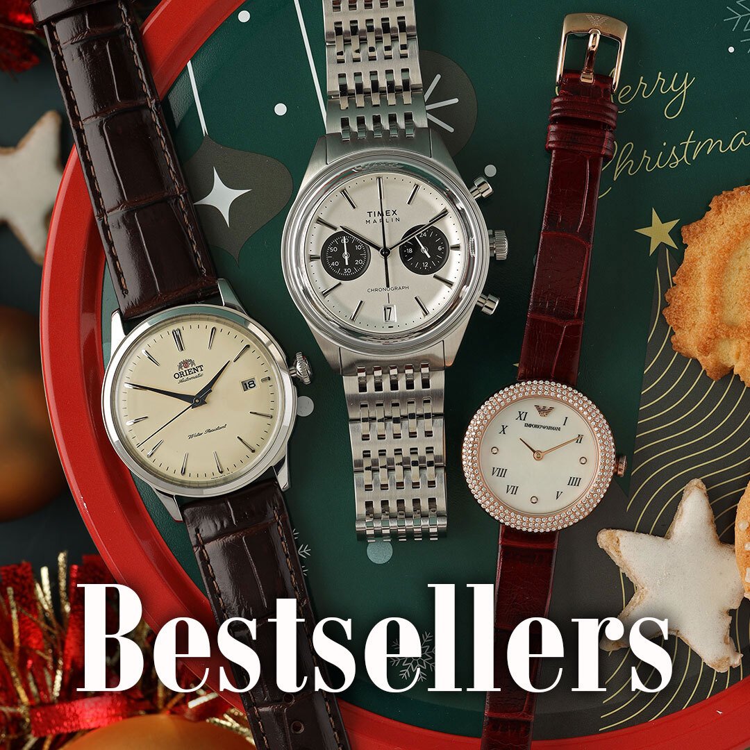 Drei Uhren auf einem grünen Kissen mit dem Text Best sellers