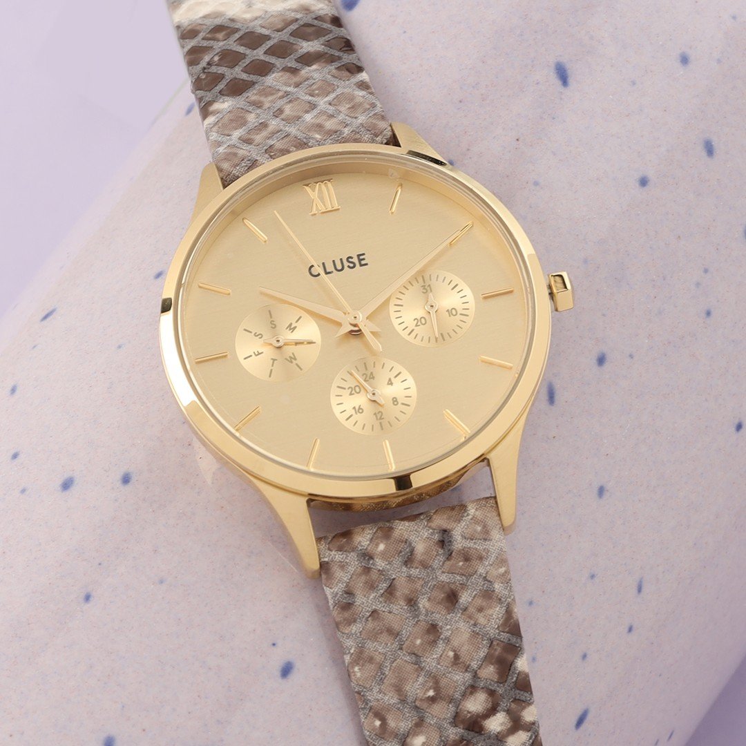Cluse watch with a snake print leater strap