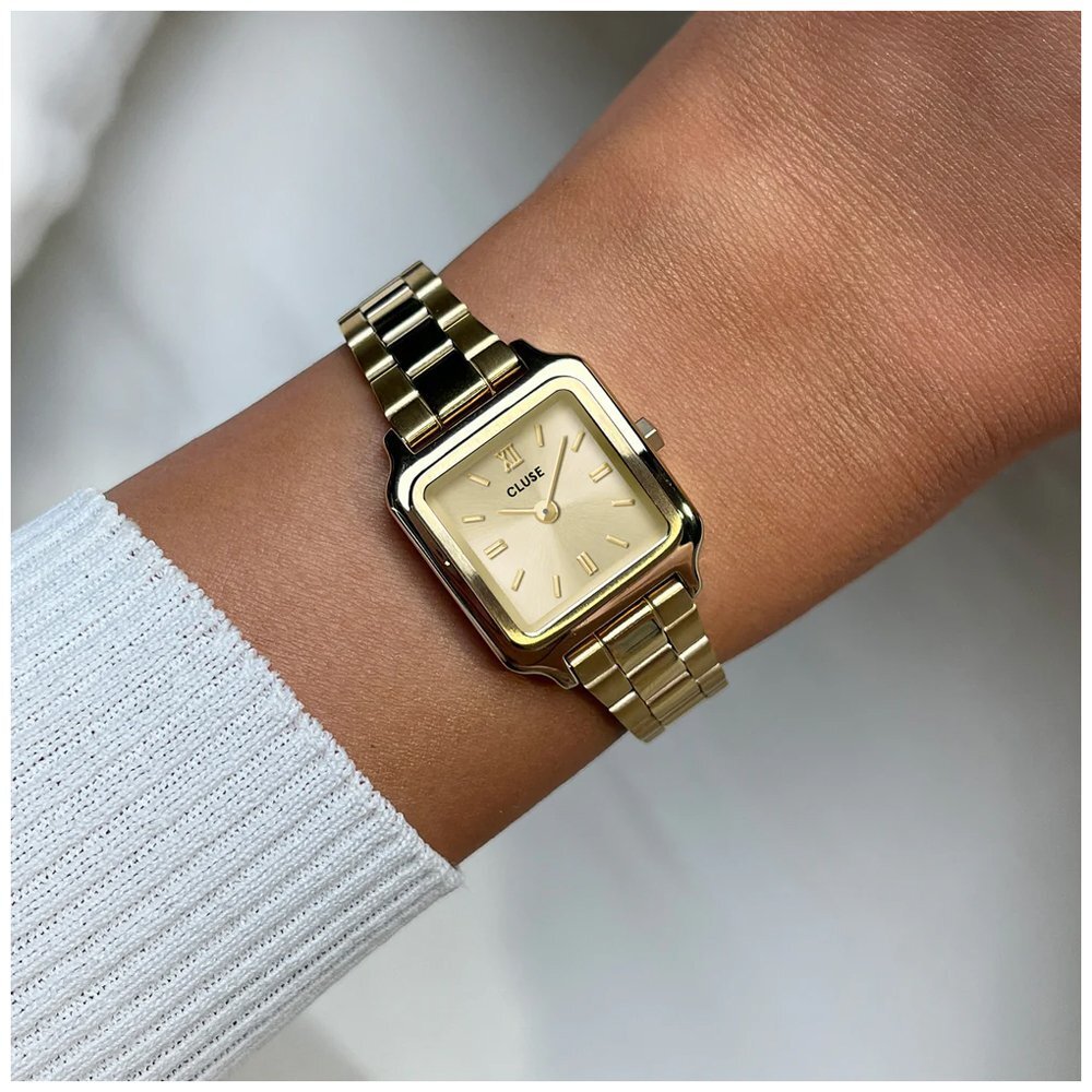 a woman's watch wearing a cluse watch