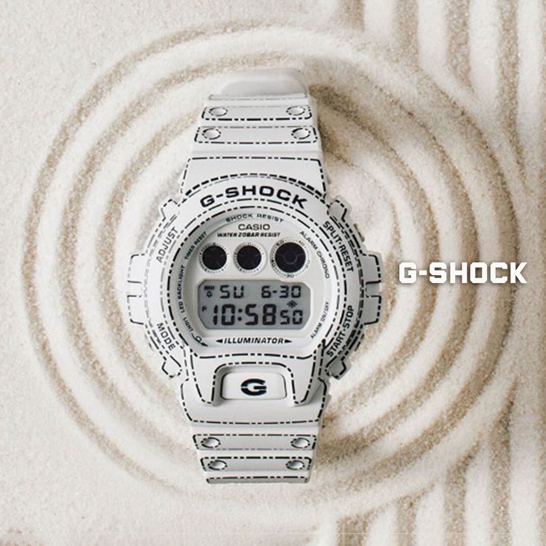 White g-shock on a sand background