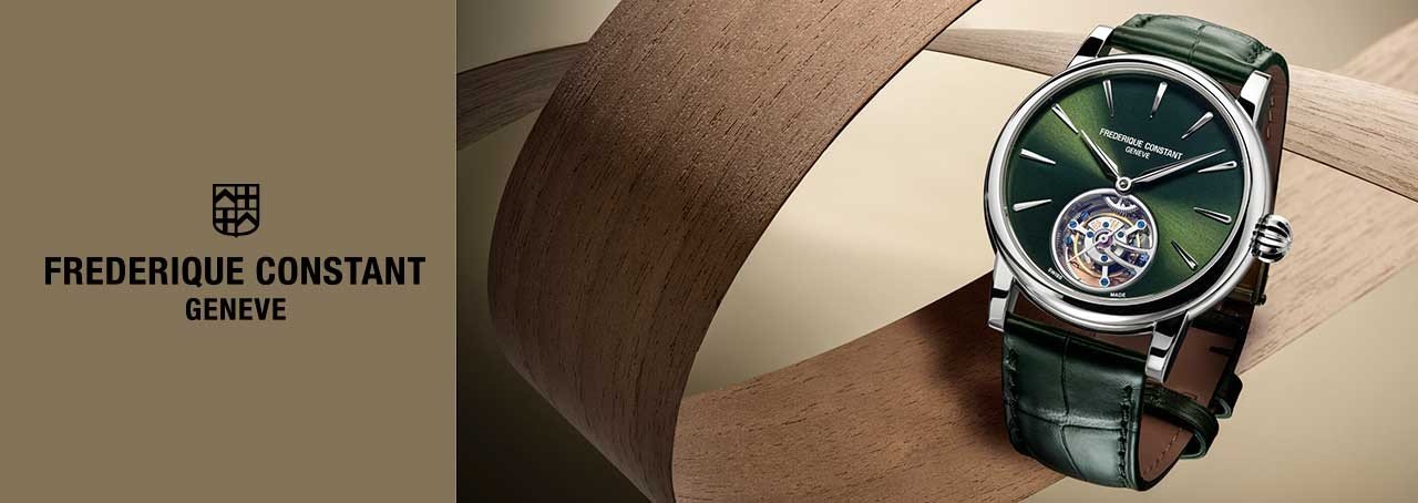 Green frederique constant watch on a brown background