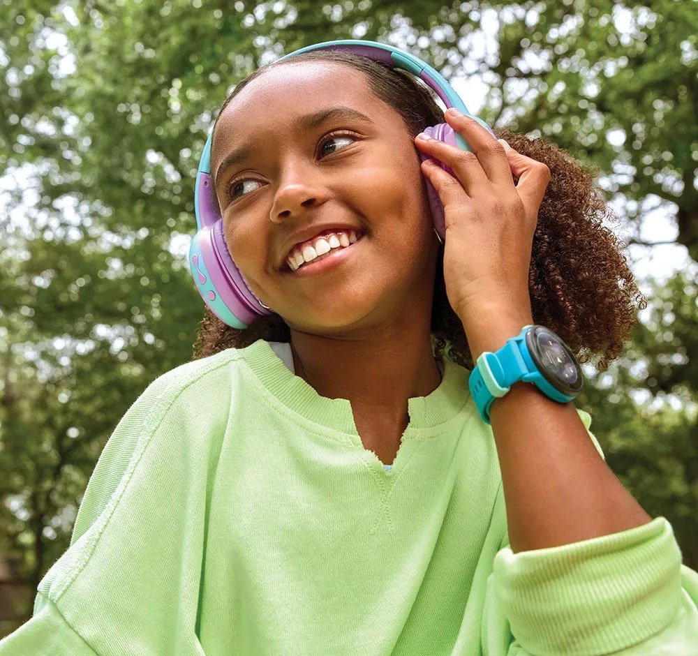 Girl with headphones and smartwatch