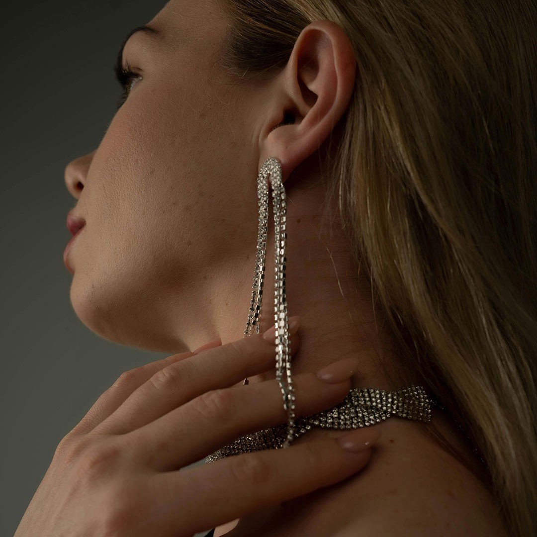blond girl wearing diamond earrings