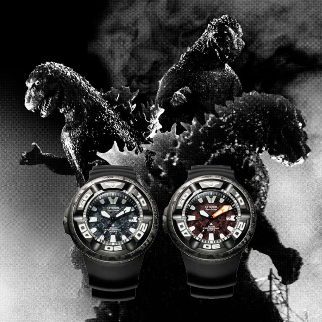 2 citizen Godzilla watches with 3 black and white godzilla monsters in the background
