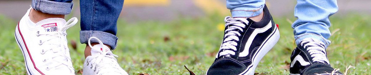a woman and a man's feet wearing sneakers