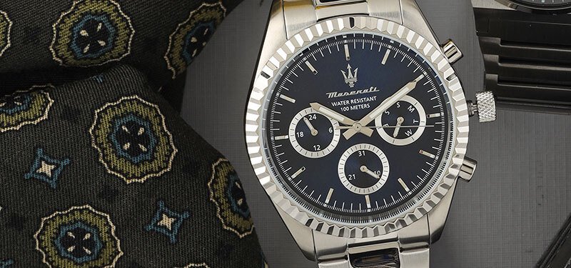 steel maserati watch with a blue dial