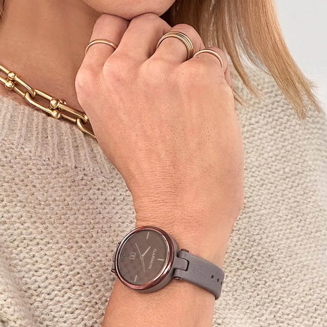 woman's wrist wearing a Garmin Lily watch