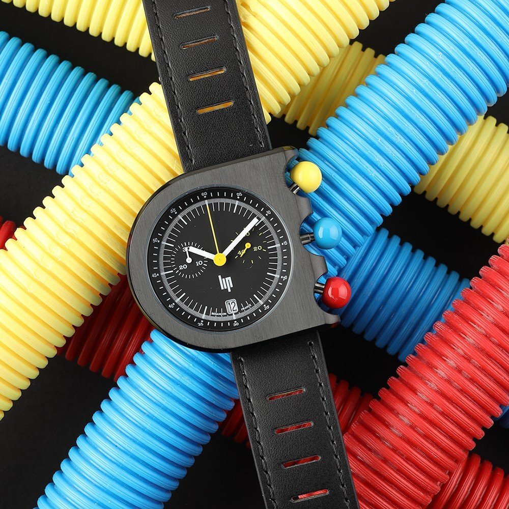 Black LIP Mach watch on colorful pipes