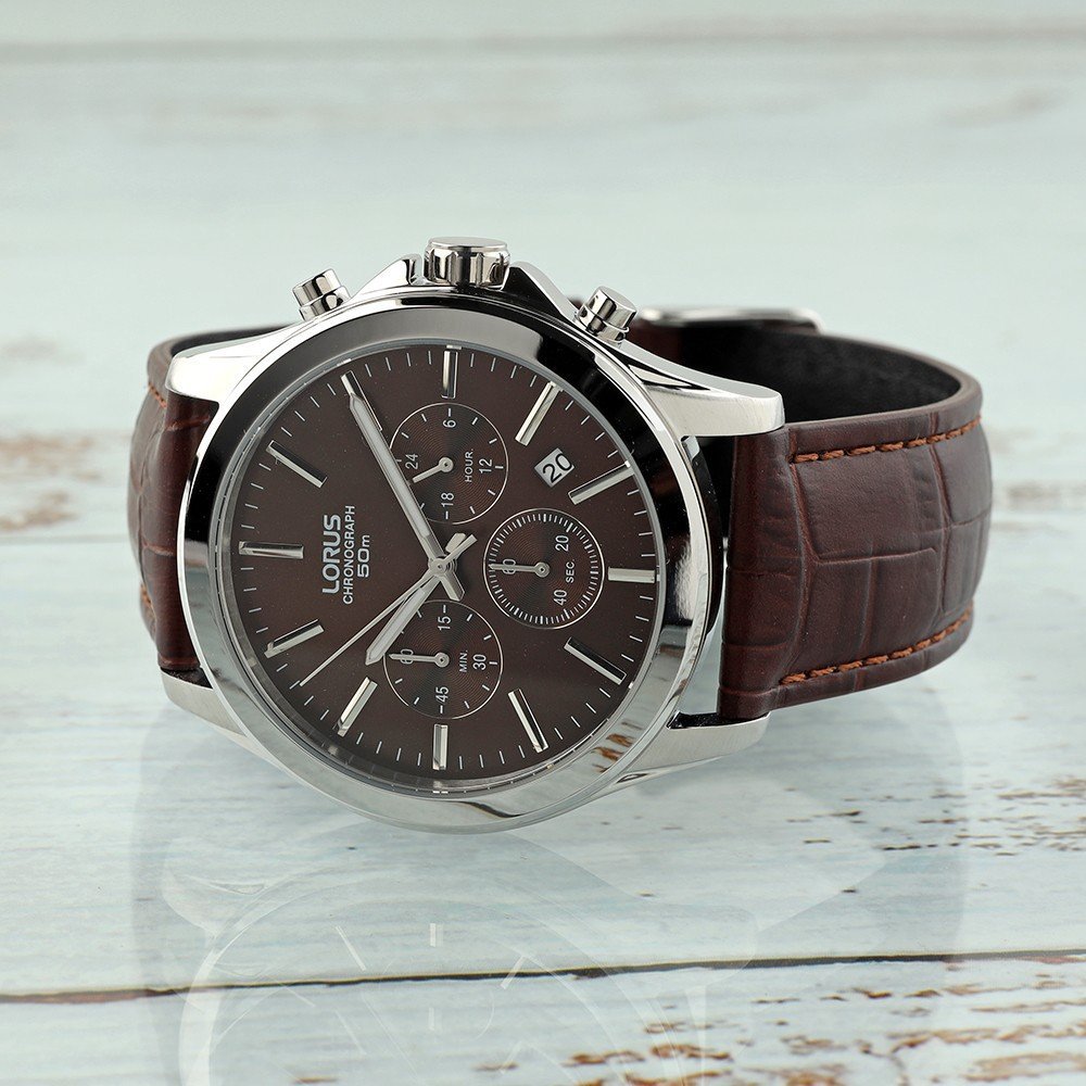 Brown Lorus watch on a glass table