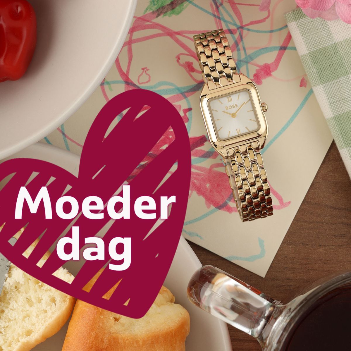 Gold Boss ladies watch on achild's drawing and a pink heart with the text Mother's Day