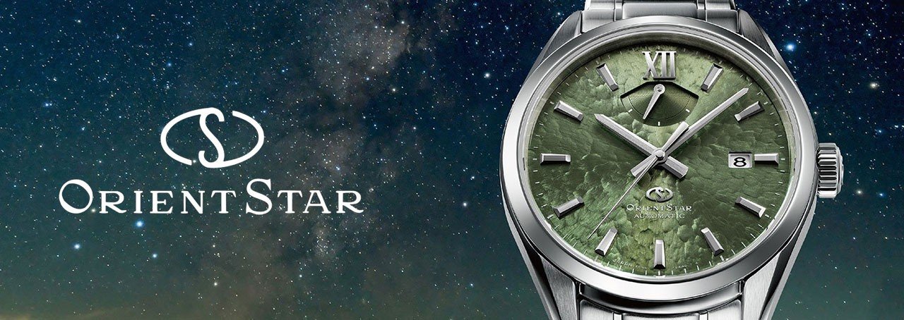 Orient star horloge en een sterrenhemel