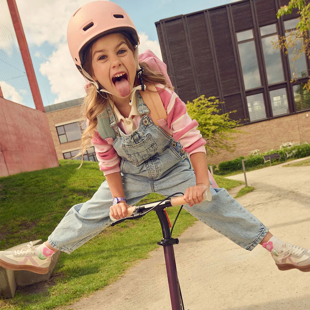 Girl playing on a bicycle