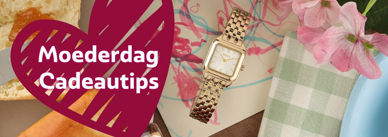 A gold Boss ladies watch on a child's drawing with a pink heart with the text Mother's Day.
