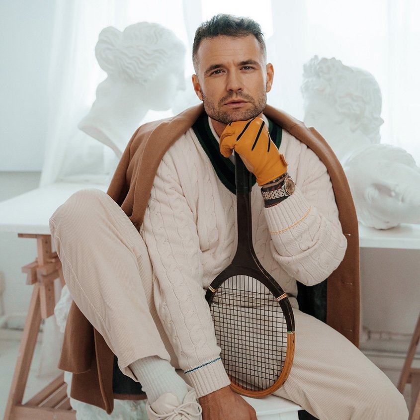 Young man in old school tennis clothes