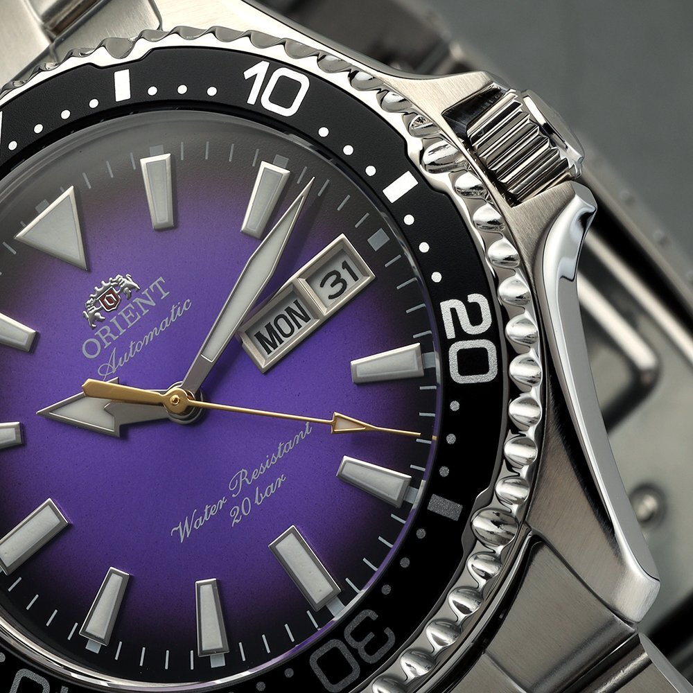 Close up of Orient watch with purple dial and a day-date window