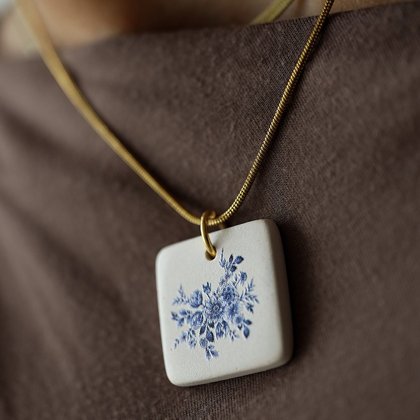 Delft Blue pendant on a gold chain