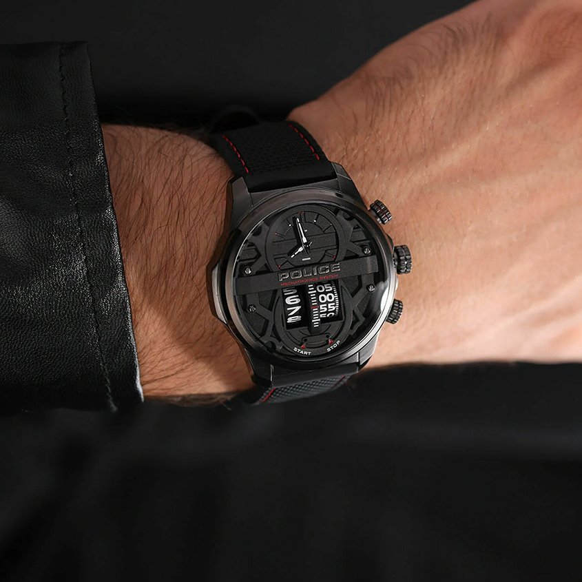 A man's wrist with a black Police watch