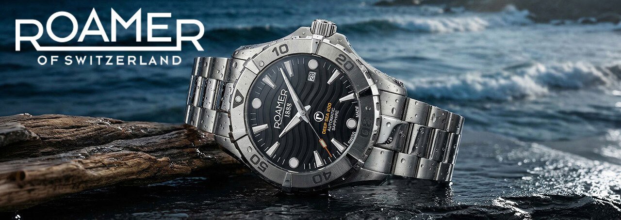 Roamer watch on a rock in the sea