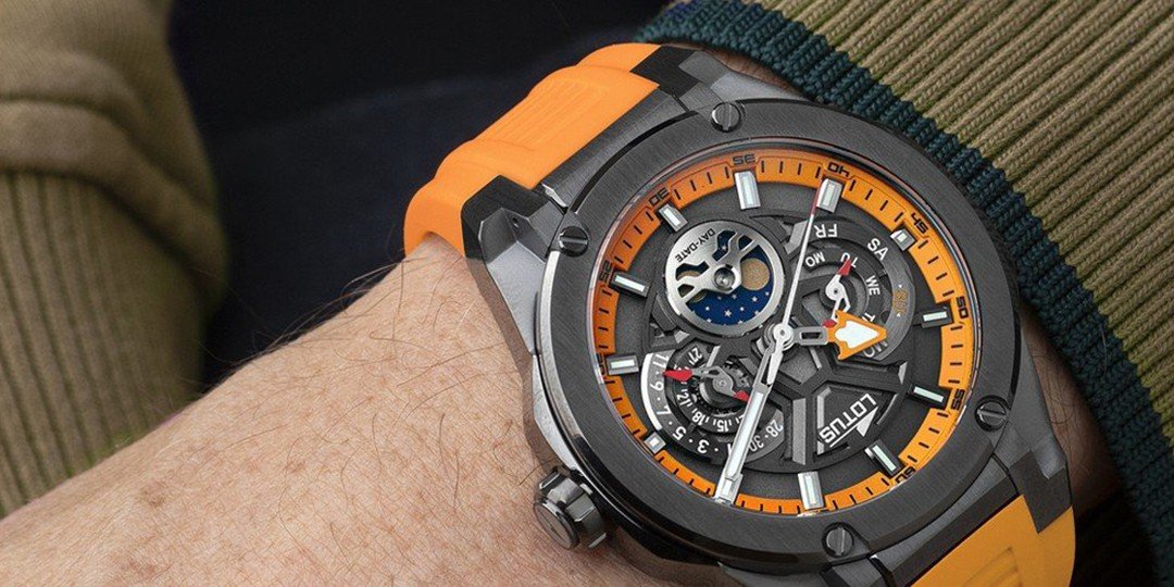 Lotus watch with an orange silicone strap