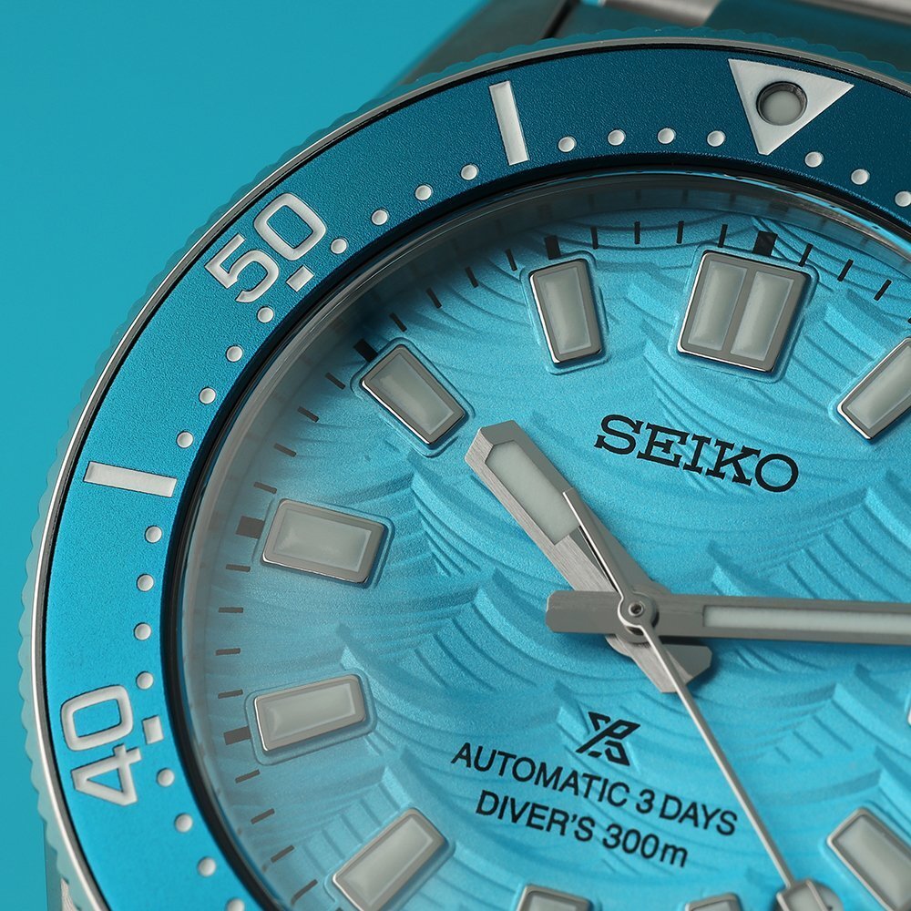 Close up of a blue Seiko watch with luminous, applied hour indices