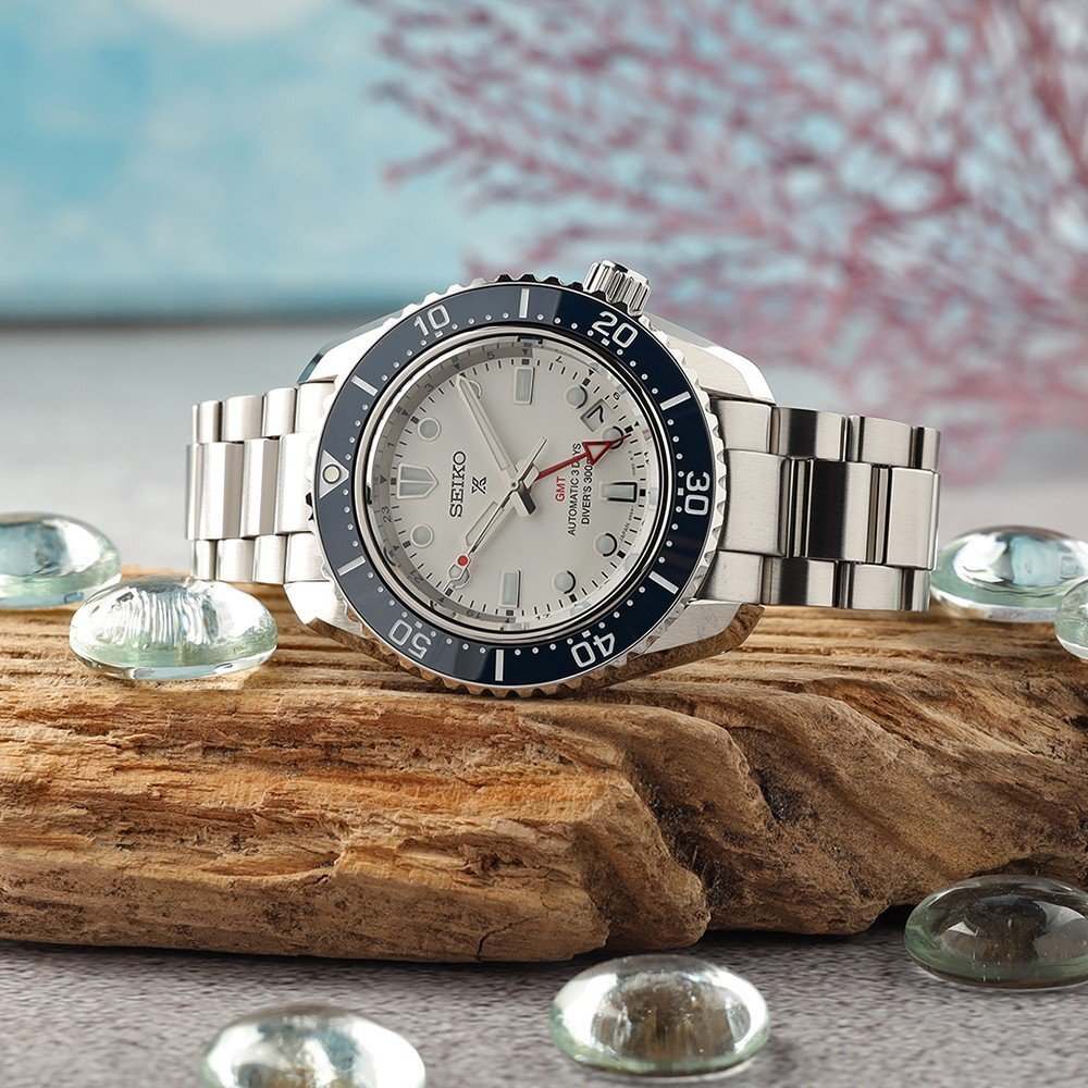 Seiko dive watch on a piece of driftwood