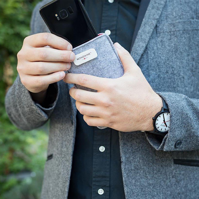 Image of person using packaging as phone cover