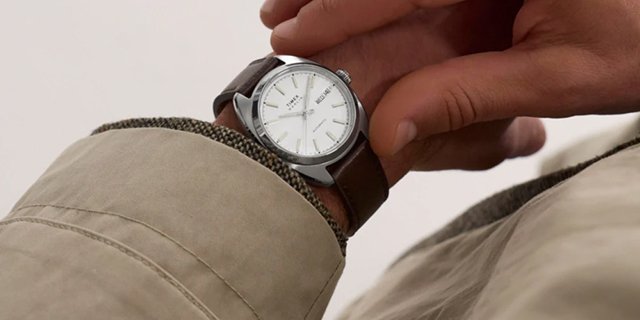 A man checks his watch