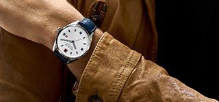 Man's wrist with a Swiss watch