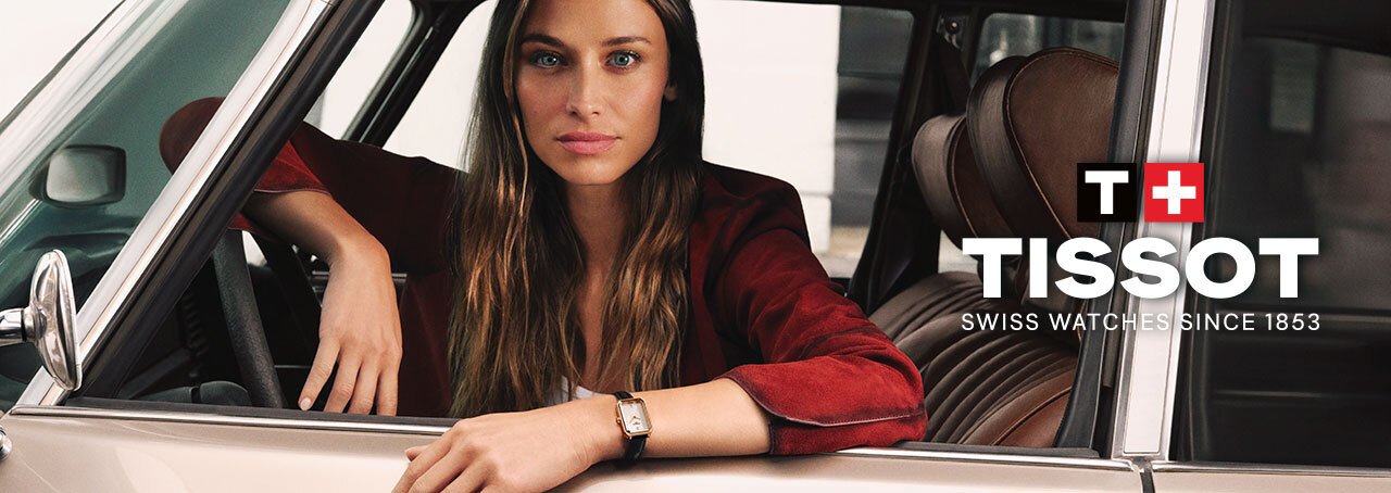 Woman sitting in car with Tissot logo