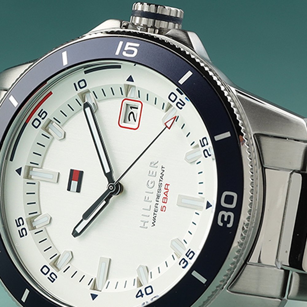 Close up of a Tommy Hilfiger watch with the brand logo on the dial