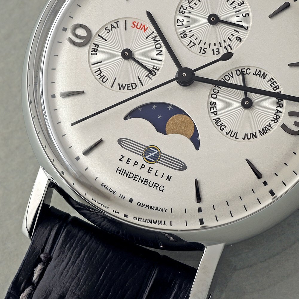 Close up of Zeppelin watch with month, day, date, and moon phase.